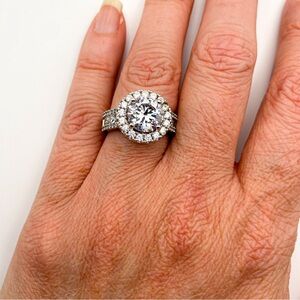 Round Cut Solitaire Halo CZ Ring with Pave and Round Cut Sides. Size 7.